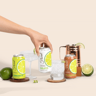 A stylish can of Delta-9 THC-infused cocktail garnished with citrus and herbs, set against a vibrant bar background.