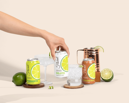A stylish can of Delta-9 THC-infused cocktail garnished with citrus and herbs, set against a vibrant bar background.