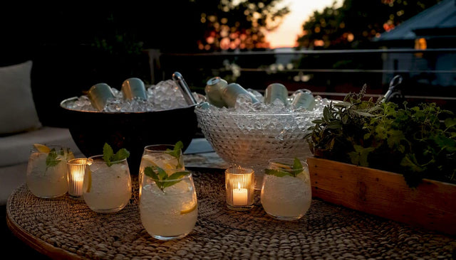 Table with THC seltzer cans and garnished glasses