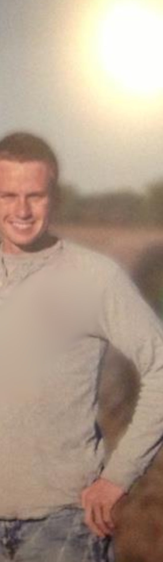 Floral Beverages father and son in their Indiana family farm field at sunset with a John Deere tractor