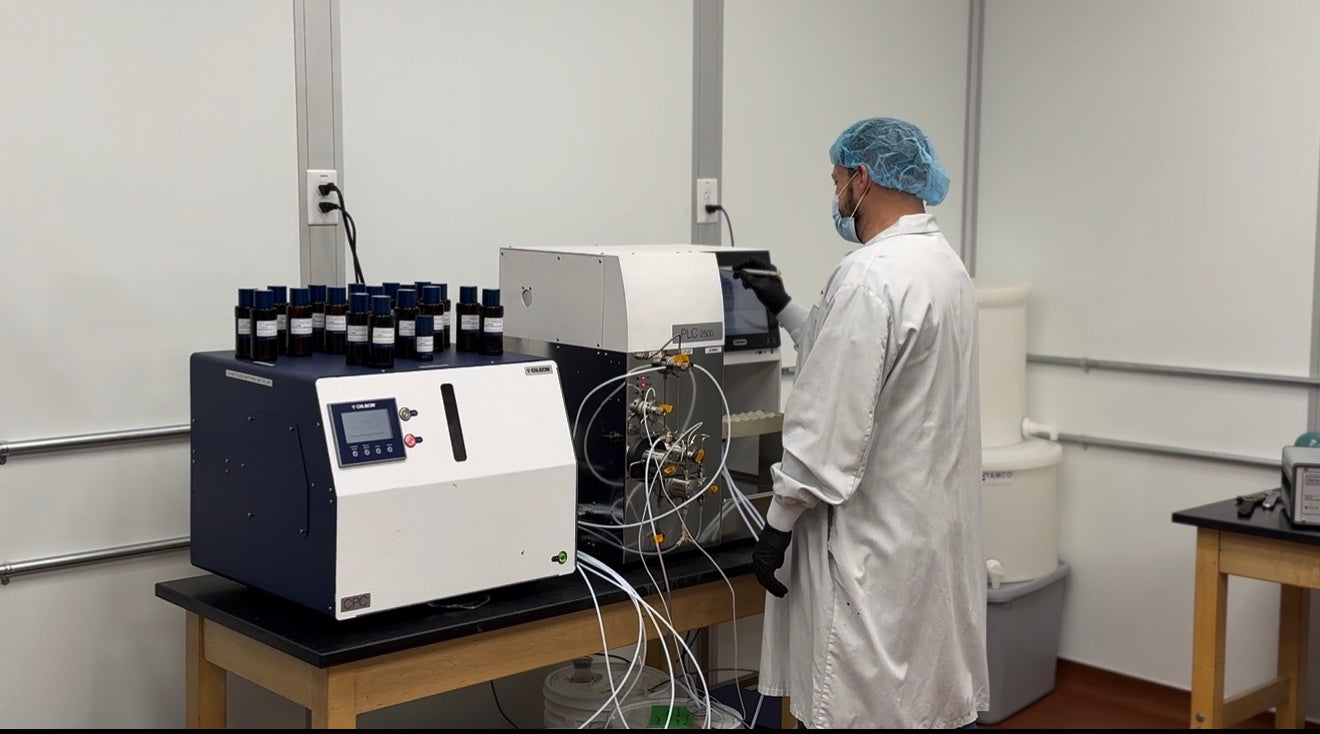 Lab technician running a chromatography instrument