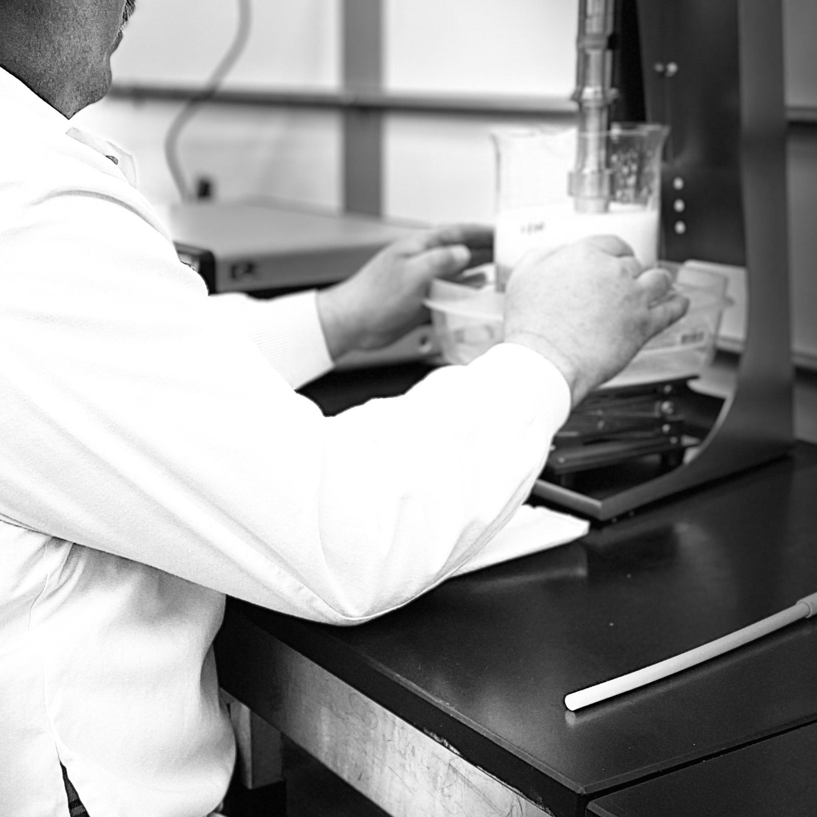 Technician preparing samples at a lab bench